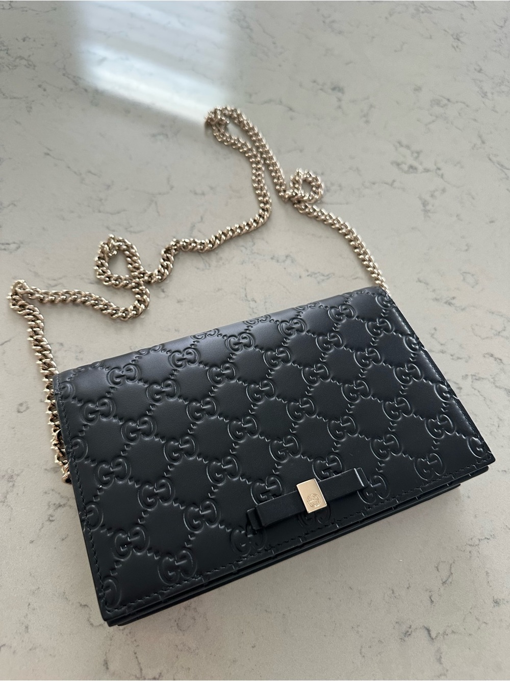 Authentic Gucci Black Embossed Leather Chain Wallet with Bow Accent